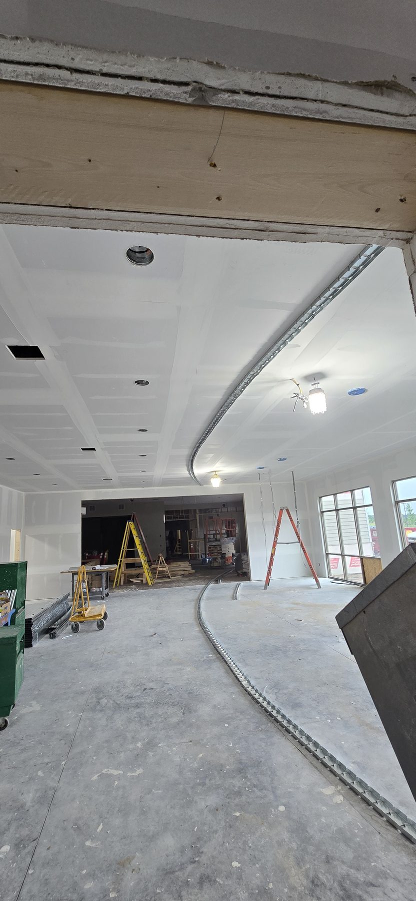 Curved drywall track and ceiling finish detail by Finishing Touch, LLC in St. Paul, MN