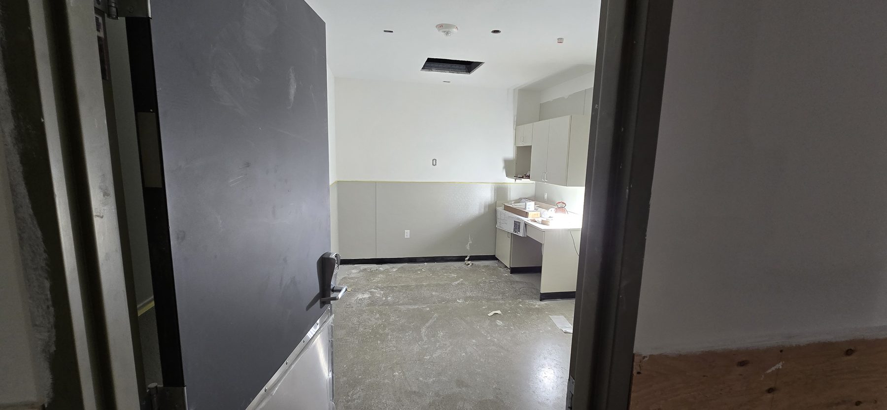 Commercial drywall finished room and wall repair work by Finishing Touch, LLC in St. Paul, MN