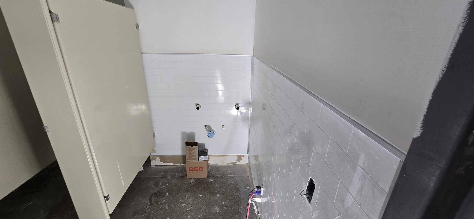 Commercial restroom drywall wall finishing by Finishing Touch, LLC in St. Paul, MN
